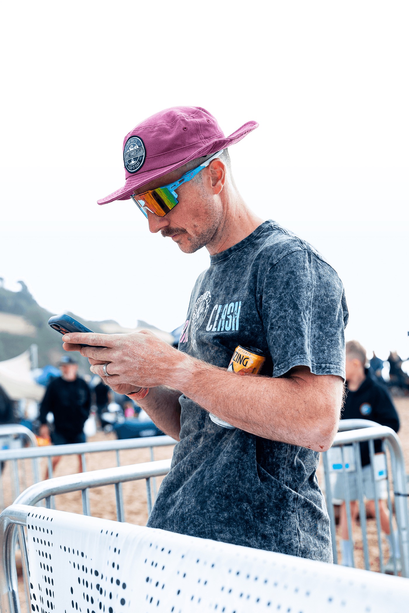 Athlete checking the Team Aretas app between workouts