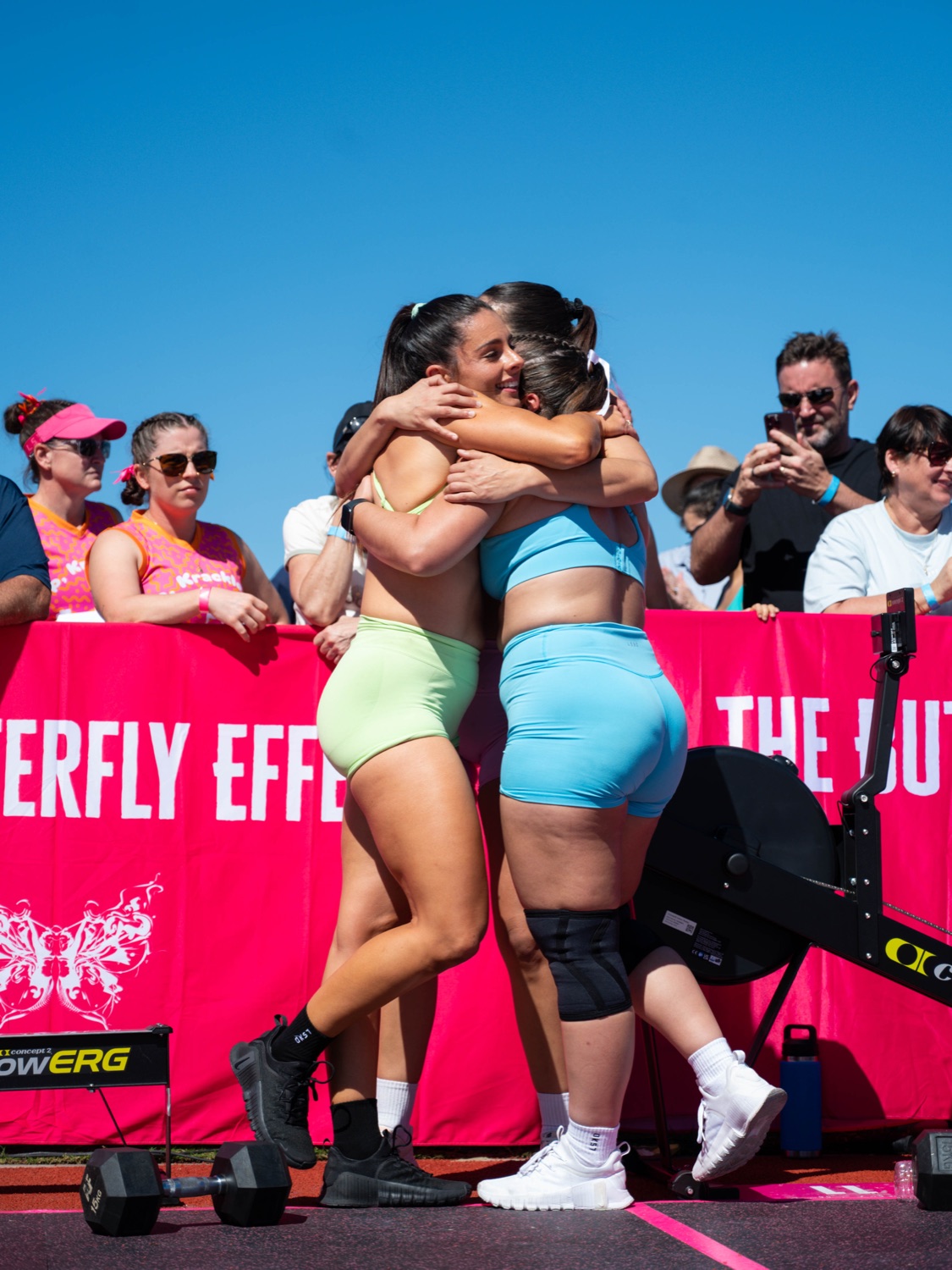 Two athletes embracing after finishing a workout at The Butterfly Effect